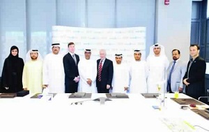 Eisa Saif Al-Qubaisi, GM, Tadweer (CWM), and Fred Moavenzadeh, president, Masdar Institute, with officials from both entities at the signing of the two-year research agreement focused on improving the process for the production of biodiesel from waste cooking oil.