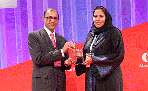 Heba Al-Tamimi, General Manager Group Retail Banking at QNB receiving the award