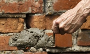 cement-hand-bricks-sustainable-green-560x325